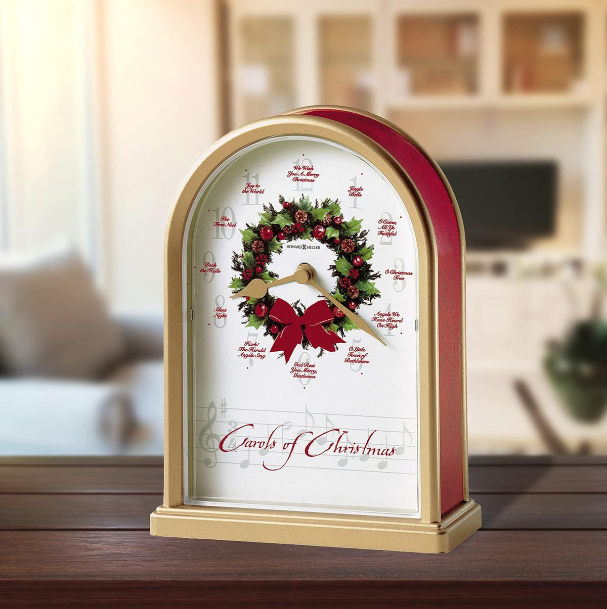 Howard Miller Carols of Christmas II Tabletop Clock – Exclusive Satin Brass Holiday Decor & Chiming Christmas Music Clock with 12 Classic Carols Festive Wreath Design Battery Operated Home Decor